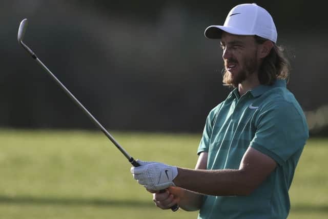 England's Tommy Fleetwood studies a shot on the 16th hole during the first round of the DP World Tour Championship golf tournament in Dubai. (AP Photo/Kamran Jebreili)
