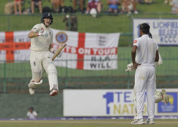 England's Joe Root celebrates scoring a century during the third day in PallekeleAP/Eranga Jayawardena