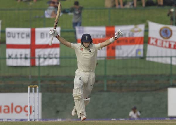 England's Joe Root celebrates as he takes a run to complete a century during the third day in Pallekele. Picture: AP/Eranga Jayawardena