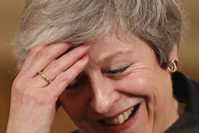Prime Minister Theresa May reacts during a press conference at 10 Downing Street, London, to discuss her Brexit plans.