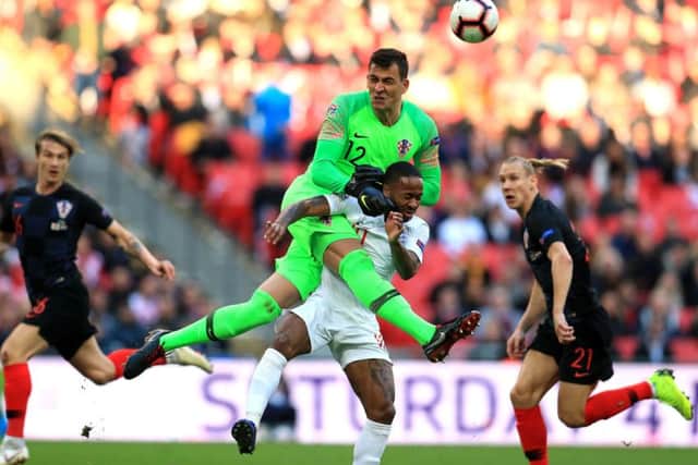 Croatia goalkeeper Lovre Kalinic (left) and England's Raheem Sterling (right) battle for the ball during the UEFA Nations League, Grouclash in the penalty area at Wembley. Picture: Mike Egerton/PA