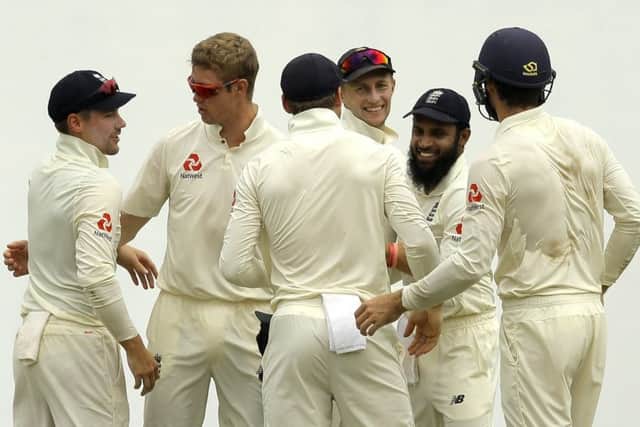 Members of the England's cricket team celebrate in Pallekele. Picture: AP/Eranga Jayawardena