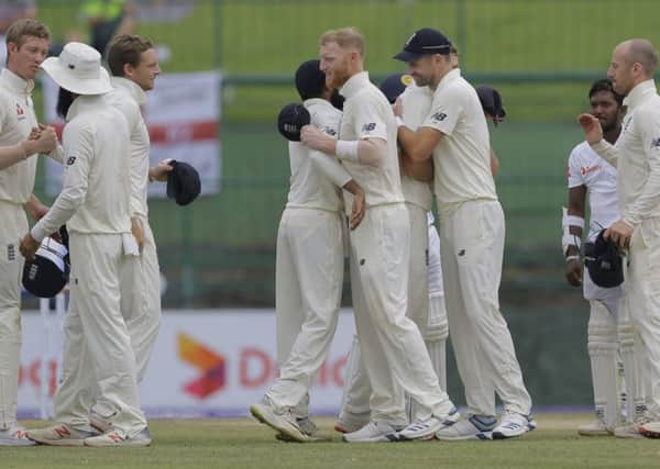 Series clinched: England's players celebrate their victory.