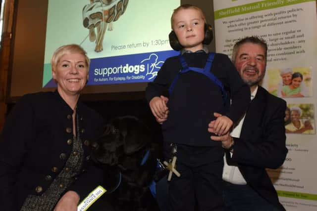 Anna, Adrian and Alex Duthie with Chester at the Support Dogs puppy parade and graduation.