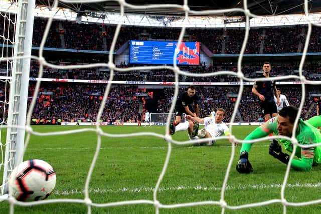 BY THE SEAT OF THEIR PANTS: England came from behind to beat Croatia with captain Harry Kane, top, sliding in for their winner at Wembley.  Picture:   Nick Potts/PA