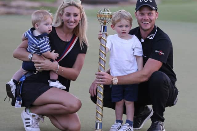 Winner: Danny Willett, wife Nicole and their children pose with the trophy after he won the DP World Tour Championship.