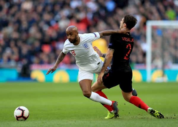 England's Fabian Delph (left) and Croatia's Sime Vrsaljko (right) battle for the ball at Wembley. Picture: Mike Egerton/PA