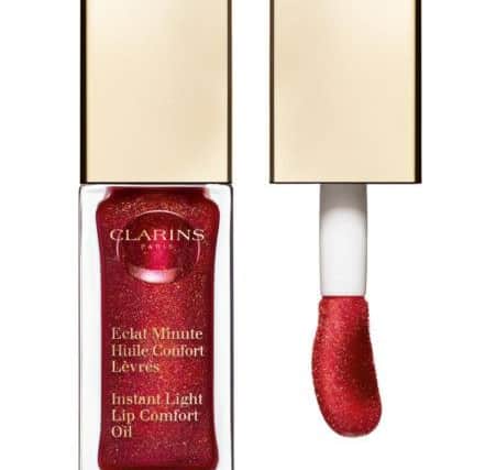 Clarins Instant Light Lip Comfort Oil: With the festive season in mind, one of the brand's most loved shades, Red Berry, gets an injection of seasonal sparkle with fine pearls and golden reflections. Hazelnut oil and organic jojoba oil soothe and comfort lips with a lightweight, non-sticky formula. In a delicious berry flavour, annatto oil gives nourishing botanical benefits. It's Â£19 on the Clarins counters.