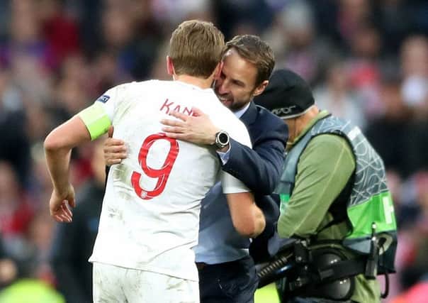 Manager Gareth Southgate hugs captain Harry Kane after Englands win over Croatia on Sunday (Picture: Nick Potts/PA Wire).