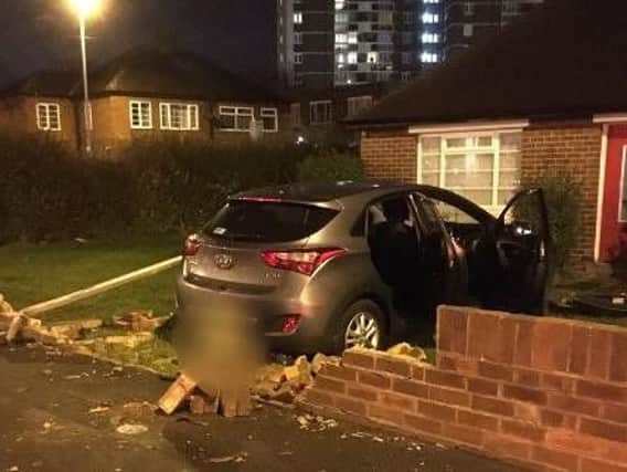 A car crashed though a garden wall on on Horbury Road, Wakefield. 
Photo: West Yorkshire Police RPU