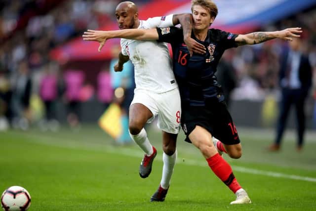 England's Fabian Delph (left) and Croatia's Tin Jedvaj (right) battle for the ball (Picture: Nick Potts/PA Wire)
