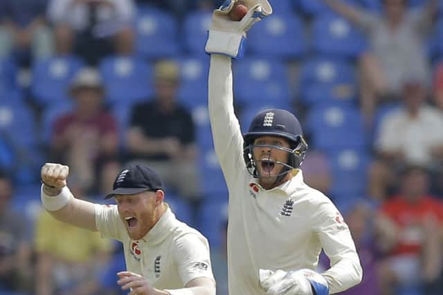 In Bairstow's place: England's wicketkeeper Ben Foakes celebrates taking a catch to dismiss Sri Lanka's Angelo Mathews with Ben Stoakes, left, during the second day of the second test match between Sri Lanka and England. (AP Photo/Eranga Jayawardena)