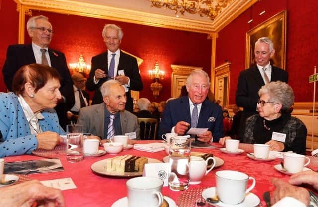 The Prince of Wales meets with members of the Association of Jewish Refugees during a reception in London, which marks the 80th anniversary of the Kindertransport.