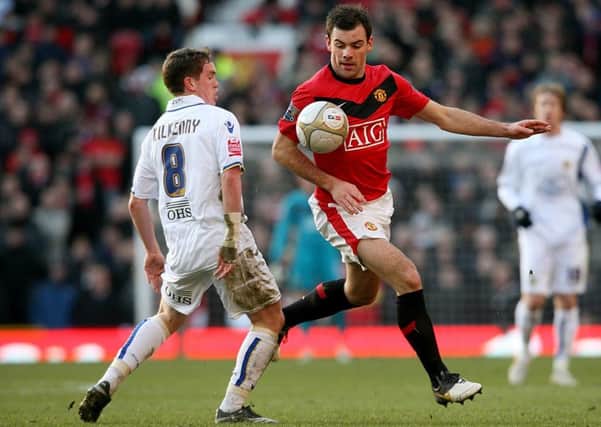 Manchester United's Darron Gibson and Leeds United's Neil Kilkenny (left) battle for the ball during the FA Cup Third Round tie at Old Trafford in 2010, the last time the two teams met competitively (Picture: Martin Rickett/PA)