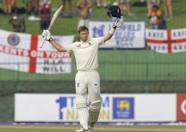 England's Joe Root celebrates scoring a century during the third day of the second testmatch between Sri Lanka and England in Pallekele. (AP Photo/Eranga Jayawardena)
