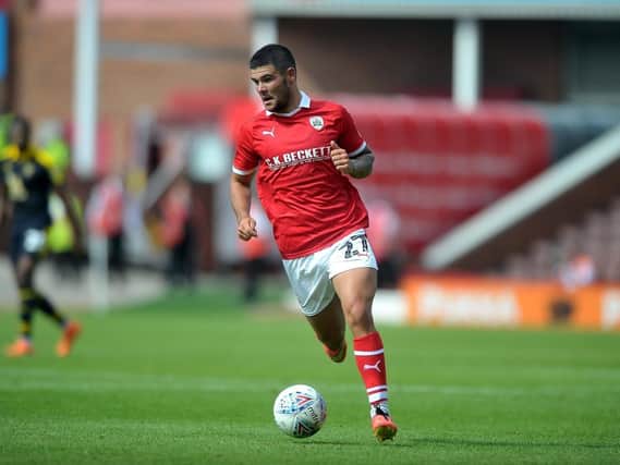 Barnsley midfielder Alex Mowatt has committed his future to the club