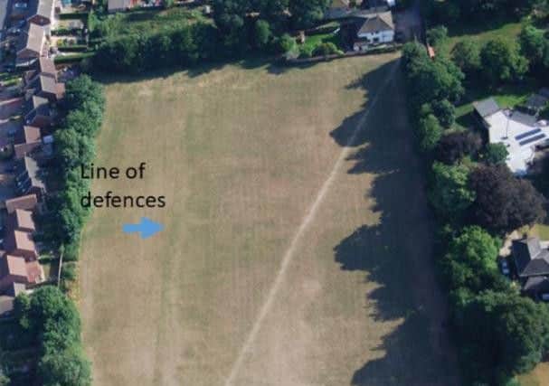 Roman walls and other walls show up in the aerial shot of the playing field