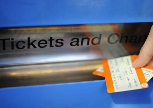 File photo dated 11/01/16 of a person buying a train ticket. Rail ticketing could be overhauled to make it fairer and easier to use.  PRESS ASSOCIATION Photo. Issue date: Tuesday May 8, 2018. A public consultation is being launched by the industry to suggest ways of simplifying the system, which will lead to a report containing proposals for governments to consider. See PA story RAIL Fares. Photo credit should read: Lauren Hurley/PA Wire