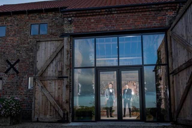 The barn doors are pulled open to reveal a dramatic glass entrance. Picture by Charlotte Graham/CAG Photography.
