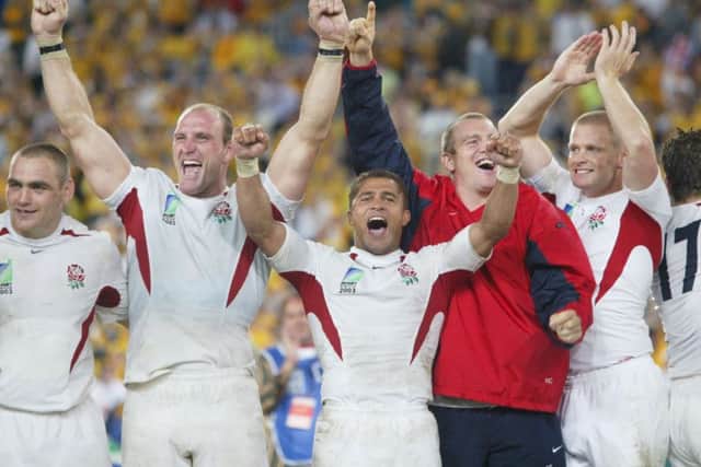 England's Jason Robinson (centre) heads the celebrations with team-mates after beating Australia in the Rugby World Cup final at the Telstra Stadium, Sydney (Picture: David Davies)