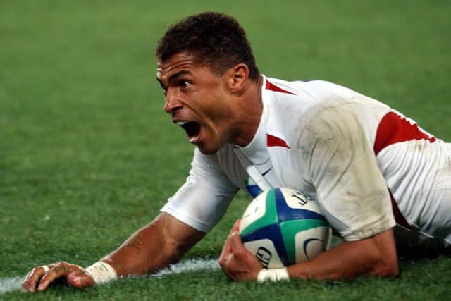England's Jason Robinson crosses the tryline for his team's only try of the triumphant Rugby World Cup final at the Telstra Stadium in Sydney Saturday, Nov. 22, 2003. (AP Photo/Adam Butler)