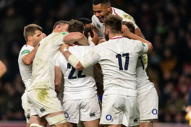 England's players celebrate scoring a fourth try against Australia at Twickenham. Picture: Paul Harding/PA