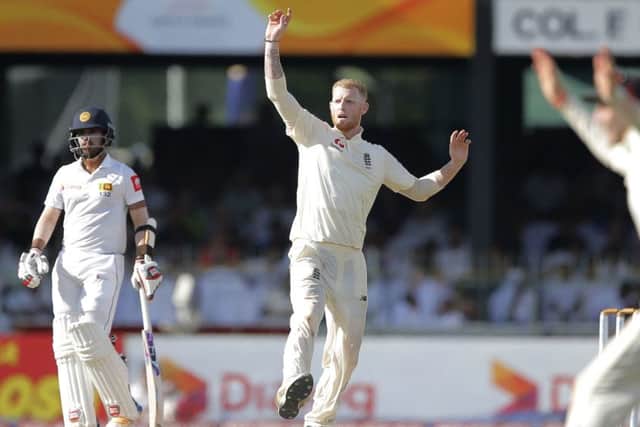 England's Ben Stokes, centre, celebrates taking the wicket of Sri Lanka's Angelo Mathews during the second day in Colombo. Picture: AP/Eranga Jayawardena