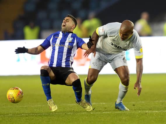 Sheffield Wednesday's Marco Matias battles for possession with Derby's Andre Wisdom. Picture: Steve Ellis