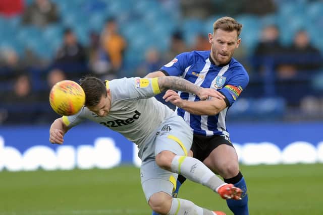 Sheffield Wednesday's Tom Lees tangles with Derby County's Jack Marriott. Picture: Steve Ellis