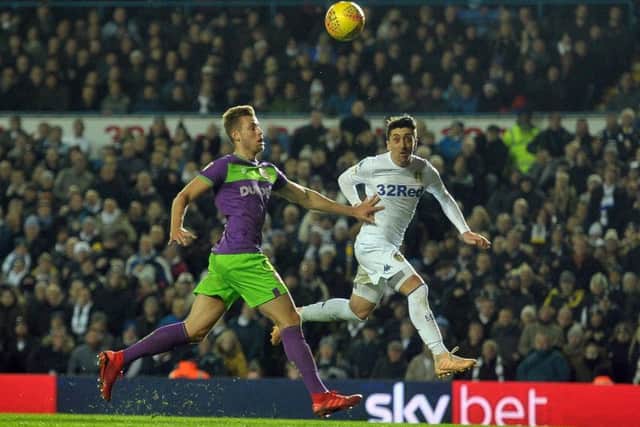 Leeds' Pablo Hernandez beats Bristol's Adam Webster to nod the ball into the goal. Picture Tony Johnson.