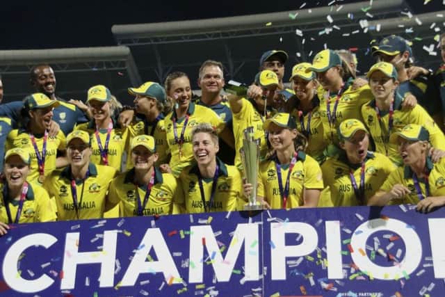 The Australian women's cricket team celebrate after beating England by eight wickets in the final of the Women's T20 World Cup final.
