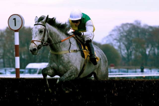 Vintage Clouds booked his place in the Grand National when winning at Haydock under Danny Cook.