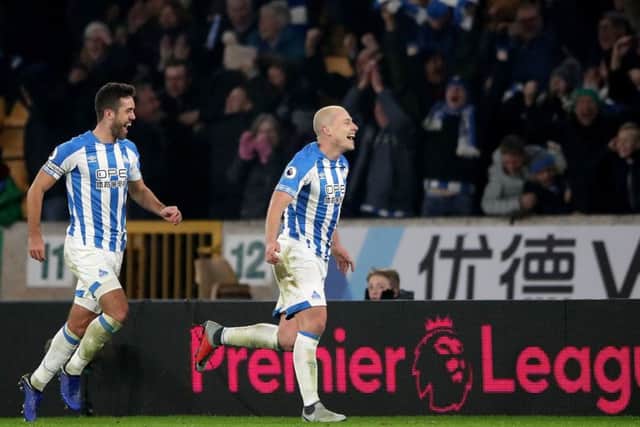 Huddersfield Town's Aaron Mooy (right) celebrates scoring his side's second goal of the game. Picture: Nick Potts/PA