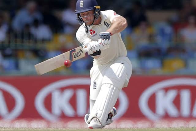England's Joss Buttler plays a shot during the third day of the third test cricket match between Sri Lanka and England in Colombo, Sri Lanka, Sunday, Nov. 25, 2018. (AP Photo/Eranga Jayawardena)