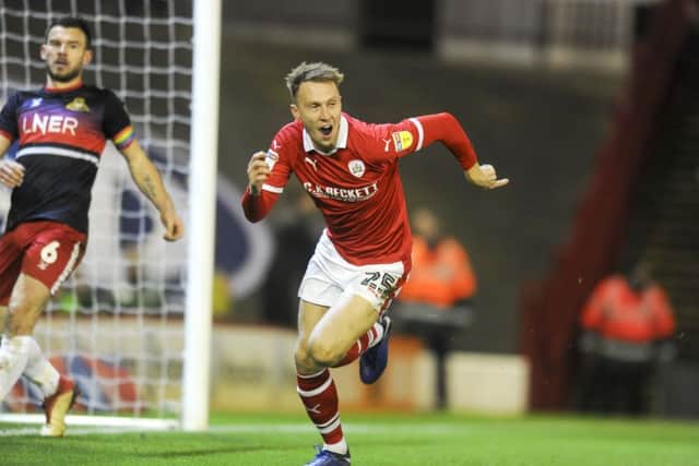 GREAT LEVELLER: 
Barnsley's Cauley Woodrow celebrates after firing the equaliser at Oakwell. Picture: Dean Atkins.