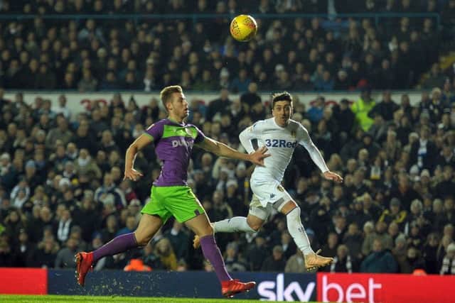 OVER YOU: Leeds United's Pablo Hernandez beats Bristol City's Adam Webster to nod the ball into the goal. Picture: Tony Johnson.