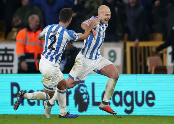 Huddersfield Town's Aaron Mooy (right) celebrates scoring his side's second goal at Molineux. (Picture: Nick Potts/PA Wire)