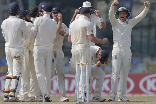 Members of the England's cricket team celebrate after taking the wicket of Sri Lanka's Roshen Silva in Colombo. Picture: AP/Eranga Jayawardena