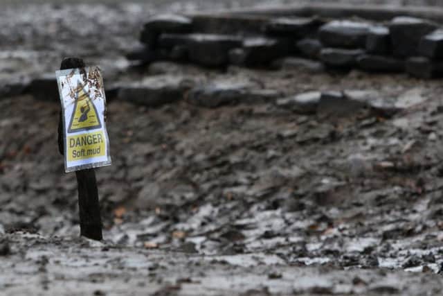 People have been rescued from mud while exploring Derwent Hall and village exposed by the very low level of Ladybower Reservoir