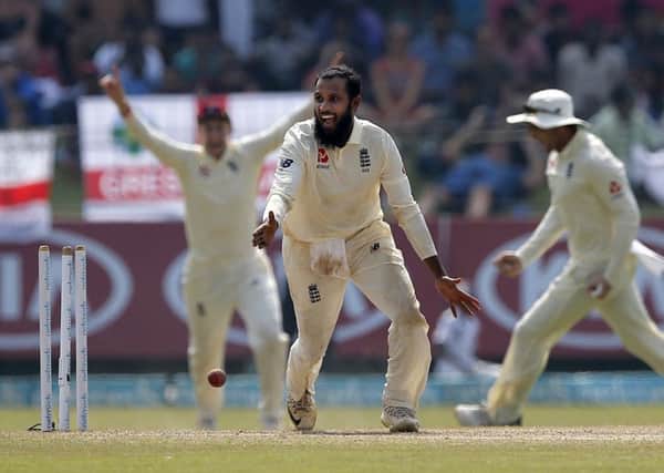 England's Adil Rashid, centre, celebrates the dismissal of Sri Lanka's Kusal Mendis during the fourth day of the third test. (AP Photo/Eranga Jayawardena)