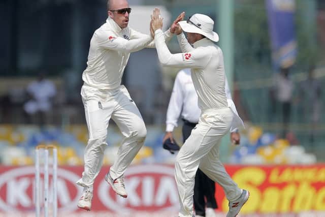 New face: Jack Leach, left, celebrates taking the wicket of Sri Lankas Lakshan Sandakan during the final day of what has been for him, and for England, a hugely successful tour. (AP Photo/Eranga Jayawardena)