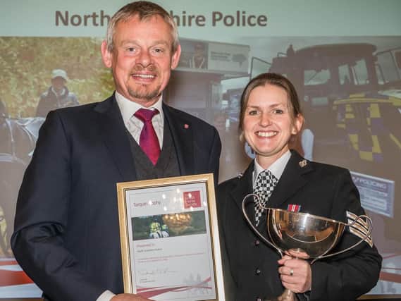 Actor Martin Clunes presents the award to Sgt Zoe Billings.
