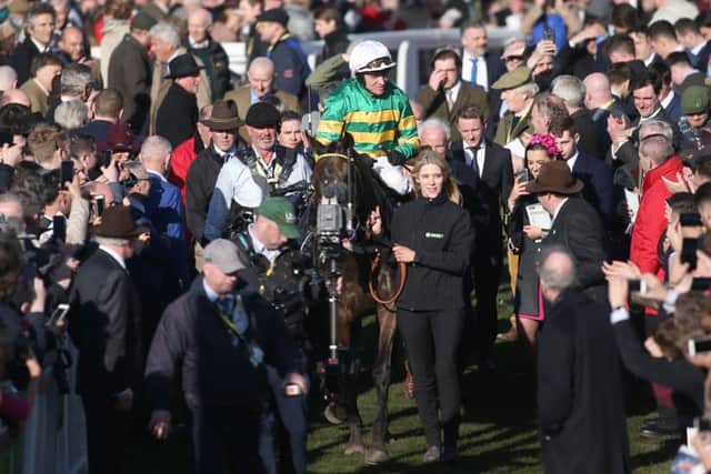 Jockey Barry Geragthy returns to the winner's enclosure after Buveur D'Air won the Champion Hurdle.