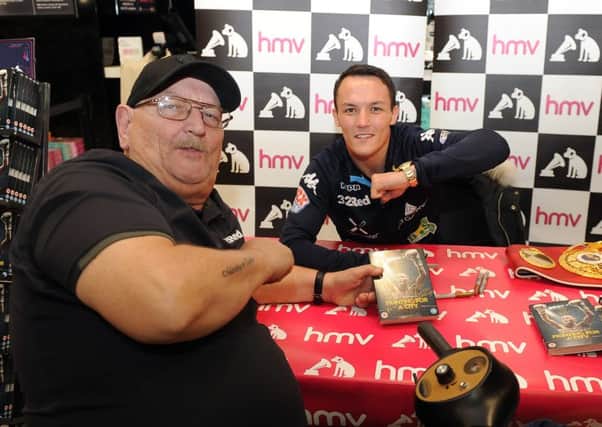 Josh Warrington signs copies of his DVD Fighting for a City at HMV Leeds..Pictured with first in the queue Don Fletcher 26th November 2018 ..Picture by Simon Hulme
