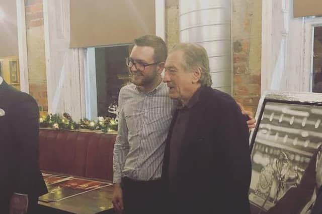 Robert De Niro poses with a fan at Ricci's Place, halifax.