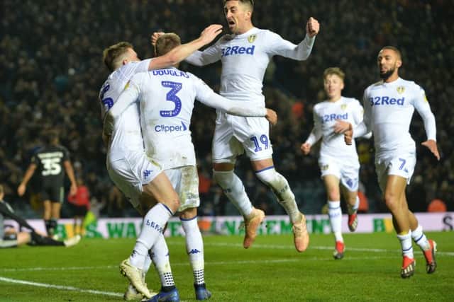 Stuart Dallas celebrates Leeds' winning goal with Barry Douglas and Pablo Hernandez.  Picture: Bruce Rollinson