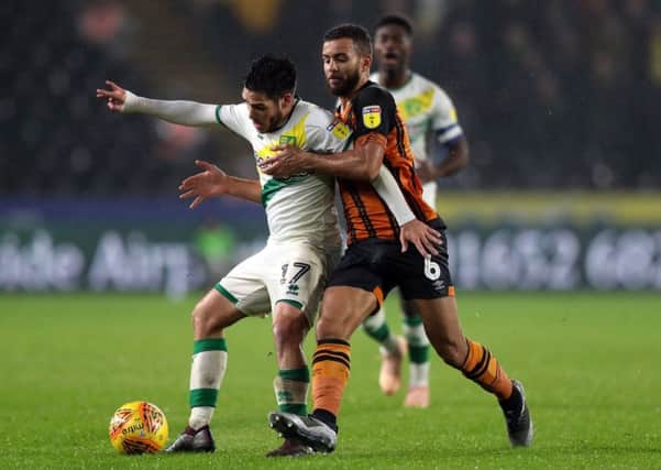 Norwich City's Emi Buendia (left) and Hull City's Kevin Stewart battle for the ball during the Sky Bet Championship match at The KCOM Stadium, Hull. (Picture: PA)