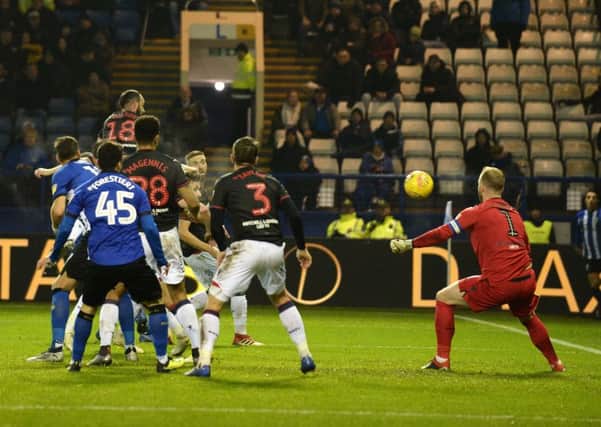 WINNING MOMENT: Sheffield Wednesday's Tom Lees (hidden) heads home what proved to be the winning goal. Picture: Steve Ellis