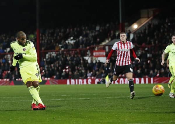 Leon Clarke scores the winning goal for Sheffield United at Griffin Park. Picture: David Klein/Sportimage