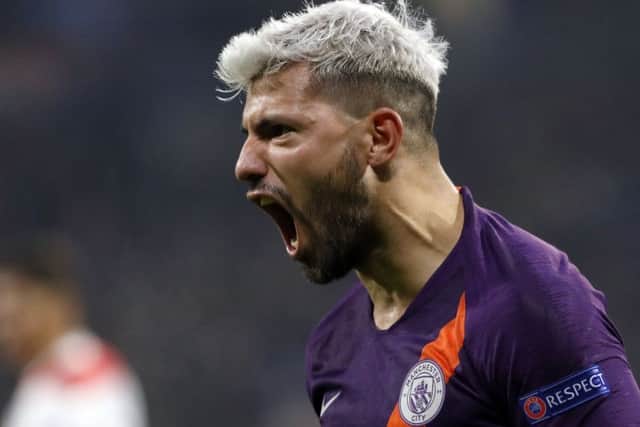 Manchester City forward Sergio Aguero celebrates after scoring his side's 2nd goal against Lyon in Decines Picture: AP/Laurent Cipriani